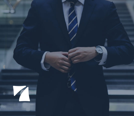 Businessman buttoning suit, in a business-like manner, for doing business.